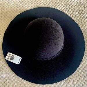 Black felt hat with braid trim. NWT One size fits all